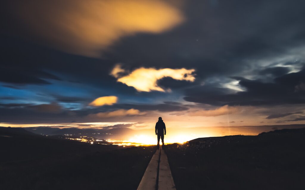 Image of a man returning over a hill
